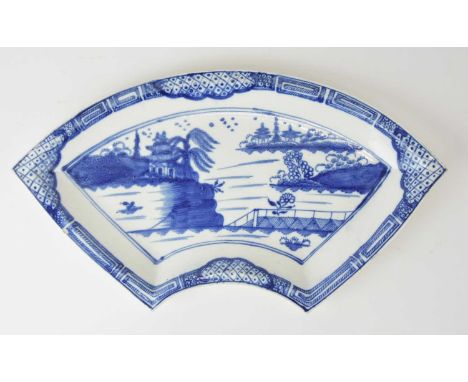 A Caughley 'Weir' fan-shaped quadrant dish, circa 1785-93, painted in underglaze blue with the central landscape with associa