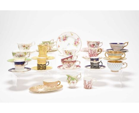 An assembled group of Coalport tea and coffee wares, late 19th century onwards, including two silver-mounted coffee cans and 
