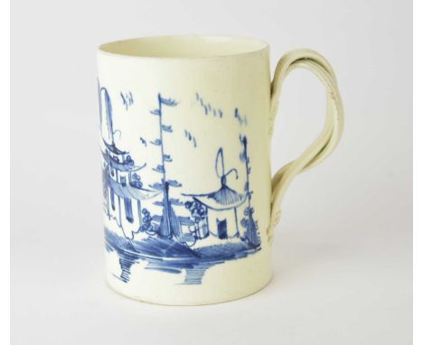 An English creamware blue and white tankard, late 18th century, probably Yorkshire, with double entwined handle with foliate 