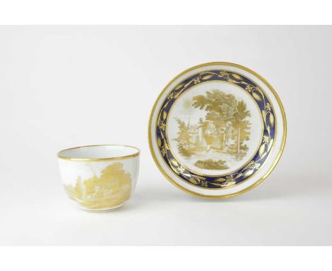 A New Hall gilt and cobalt teacup and saucer, circa 1810, printed with a gilt central scene per Peter Warburton's patent of t