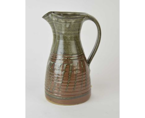 A St. Ives studio pottery jug in the style of David Leach (1911-2005), faint St. Ives seal mark below handle, 24cm high