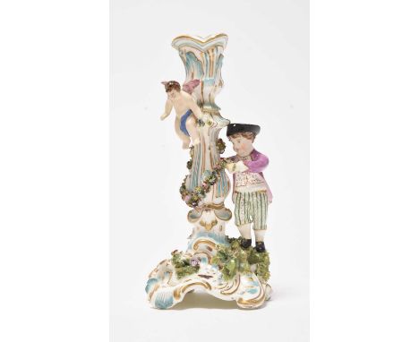 A rare Coalport figural candlestick, circa 1825-35, the candlestick and picked out in turquoise and gilt, with a male figure 