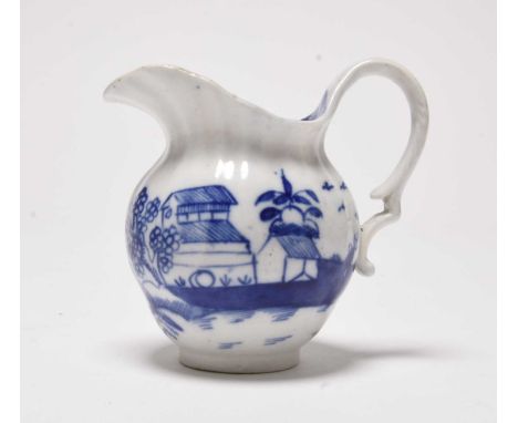 A very rare Caughley milk jug in the 'Ark' pattern, circa 1790, of helmet form with fluting, painted in underglaze blue with 