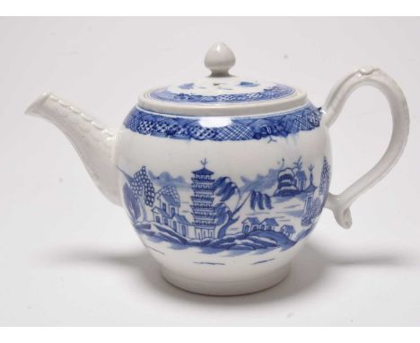 A Caughley 'Tower' pattern teapot and cover, circa 1788-95, painted in underglaze blue, the spout and handle with moulded det