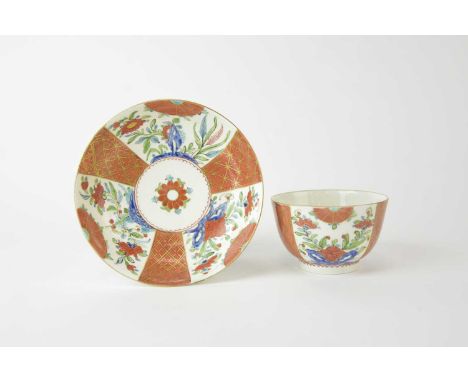 A Caughley polychrome tea bowl and saucer decorated in the 'Scarlet and Gold Japan' pattern, circa 1785-90, with three bands 