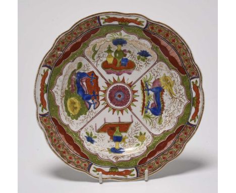 A Caughley 'Dragon in Compartments' dessert plate, circa 1785-90, of lobed form, decorated in overglaze enamels, unmarked, 20