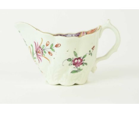A Worcester low Chelsea ewer cream jug, circa 1775-85, painted in polychrome with a large pink rose and other flowers, unmark