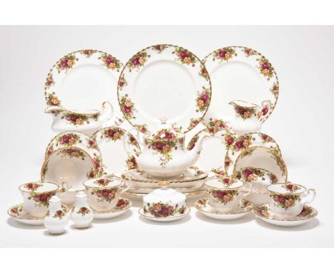 A Royal Albert Old Country Roses tea and dinner service, comprising twelve teacups, twelve saucers, cream jug, sugar bowl, te