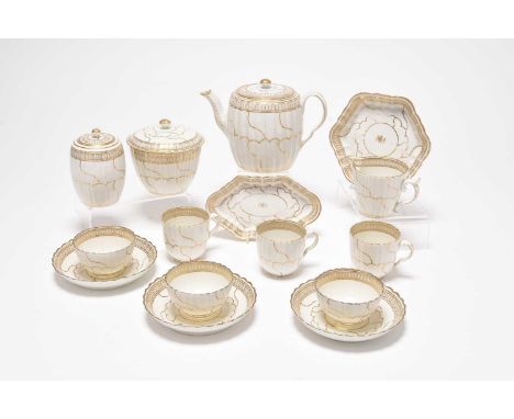 A Caughley gilt and white tea service in the 'Queen's Pattern', circa 1785-90, of fluted form, comprising a teapot and cover 