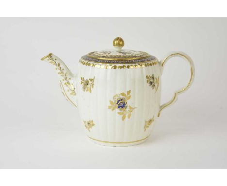A Caughley 'Dresden Flowers' teapot and cover, circa 1788-93, of fluted barrel form with ear-shaped handle, painted in underg