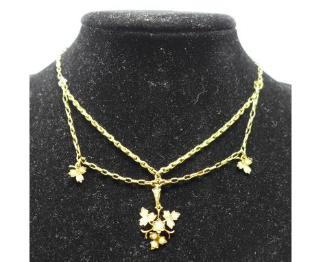 A mid-Victorian, 15ct yellow gold chain necklace suspended by seed pearl-studded leaf drops, L: 38cm, 7.3g 