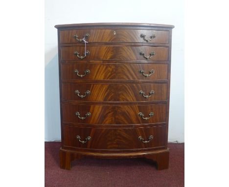 A figured mahogany bow fronted chest of 6 graduated drawers, on bracket feet, H.82 W.64 D.44cm 