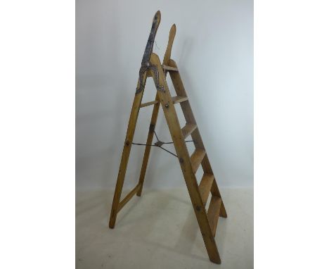 An antique pine and iron mounted 'Simplex Ladder', with Self Acting Stop, Patent No. 6958, H.154cm 