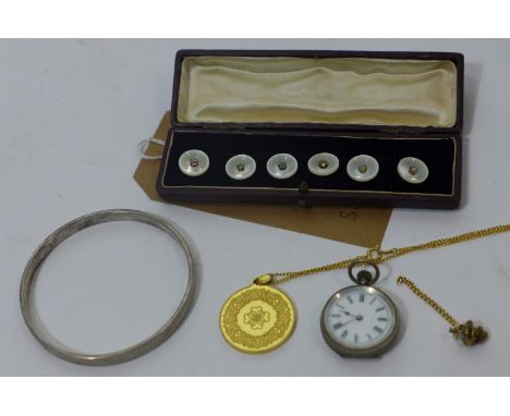 A silver bangle by Charles Horner, Chester 1924, together with a Continental silver small open face pocket watch, enamel dial