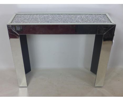 A contemporary console table, the diamante top above bevelled glass supports, H.82 W.101 D.31cm 