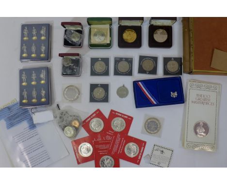 A collection of coins, to include 5 packaged 1972 Cayman Islands Sterling silver $25, specimen uncirculated edition; 5 packag