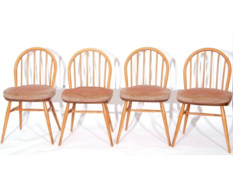 1960s Ercol rectangular dining table together with a set of four similar stick back chairs