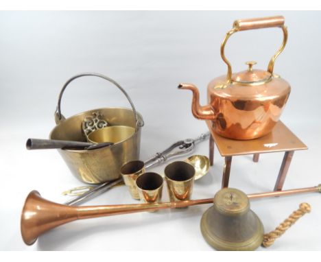 A quantity of 19thC and later metalware, to include a 19thC brass ladle, three brass beakers with punched decoration, a coppe
