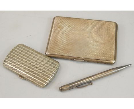 An engine turned silver cigarette box, engraved to the interior A J Averill, Birmingham 1940, 5¾oz, a silver plated cigarette