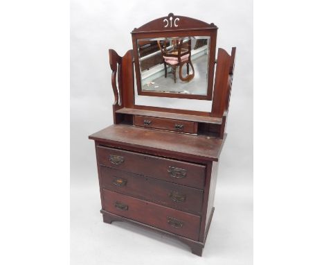 A Victorian mahogany dressing chest, the raised back with a bevelled plate, and a trinket drawer, the base with three drawers