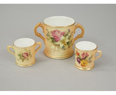 Three Royal Worcester porcelain miniature items, each with a blush ivory ground and painted with flowers, to include two lovi