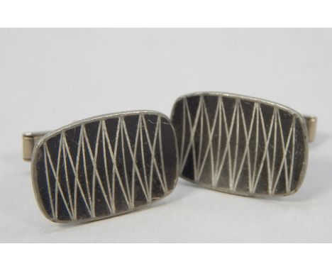 A pair of Danish cufflinks, pewter with enamel decoration, marked Jenson.