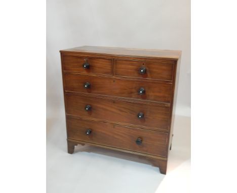 An early 19thC mahogany chest of two short and three long drawers, with ebonised drawers, and handles, on bracket feet, 107cm