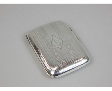 A silver Art Deco period engine turned cigarette case, the lid engraved with the letter E, Birmingham 1924, 1½oz