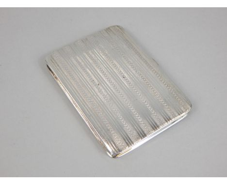 An engine turned Art Deco style small silver cigarette case, with a gilt interior, marks indistinct, 2¾oz
