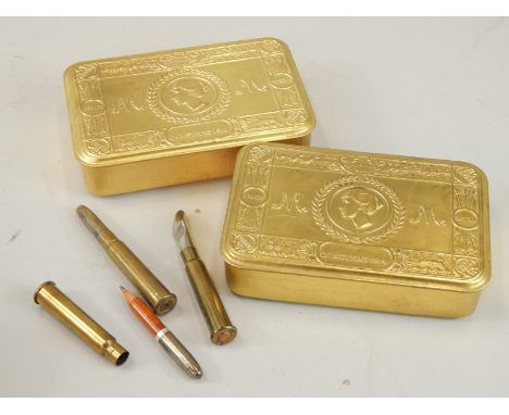 Two First World War 1914 Christmas tins, each containing a decommissioned bullet.