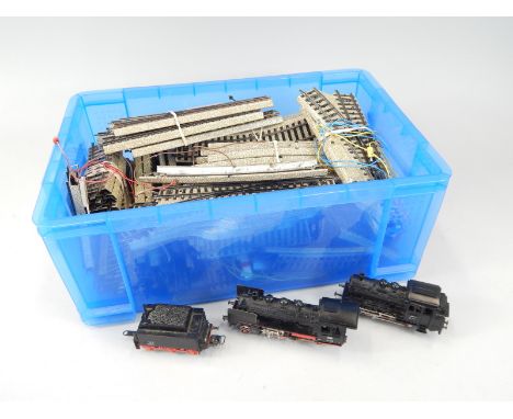 A Marklin train set, with track, locomotive and carriage. 