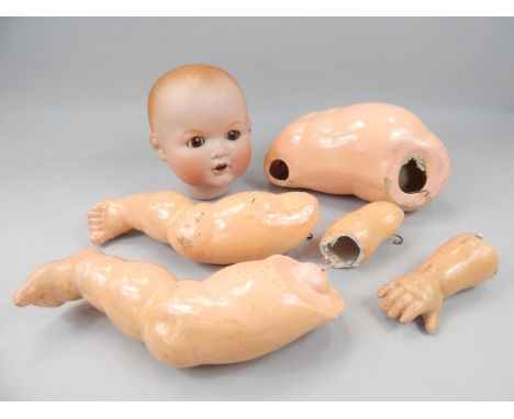 An Armand Marseille bisque headed doll, number 518/9.K with papier mache limbs, (AF)