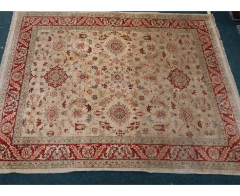 A Zeigler type carpet, with a design of medallions, leaves, flower heads, etc, with multiple borders, 266cm x 203cm.