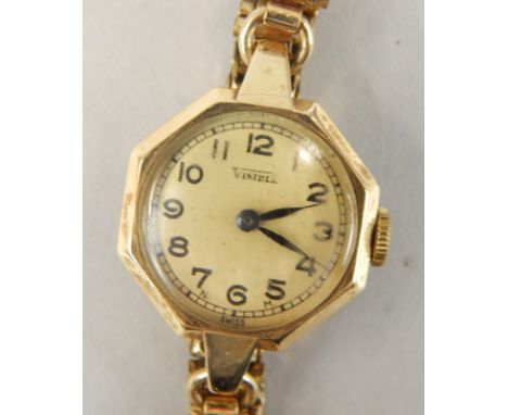 A 1920's style Visible ladies 9ct gold cocktail watch, of octagonal form with circular dial having Arabic numerals and minute