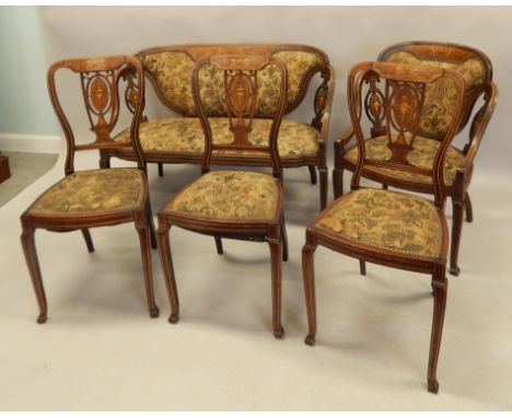 A late 19thC / early 20thC mahogany and marquetry salon type suite, decorated overall in ivorine and box wood etc, with mythi