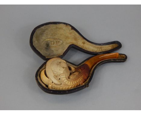 A late 19th/early 20thC meerschaum pipe, carved in the form of a chicken's claw, the leather case stamped with initials A.D.P