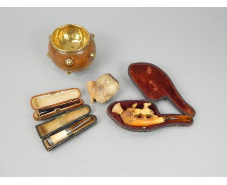 Various smoking related items, to include a meerschaum pipe carved with two horses, one carved with a negro head, two cheroot