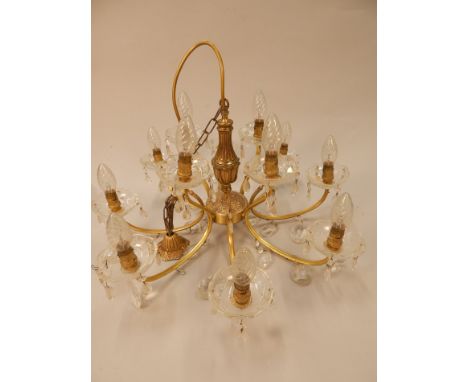 A modern twelve branch chandelier, with suspended drops.