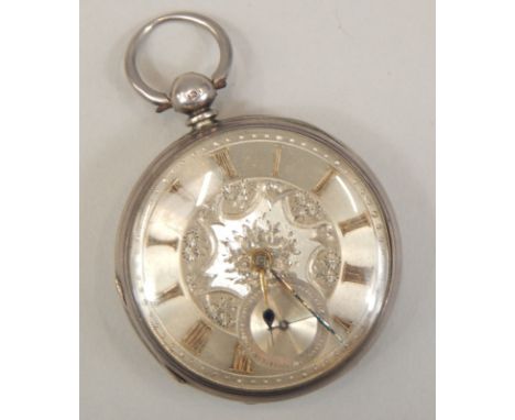 A Victorian silver key wind open face pocket watch, having engine turned dial with foliate scroll decoration, applied gilt Ar