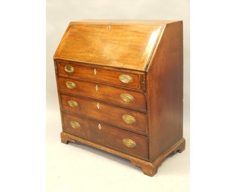 A George III mahogany bureau, the fall enclosing a fitted interior above four graduated drawers, with later oval brass handle