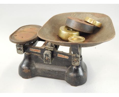 A set of enamel kitchen scales, stamped W & T Avery and various weights