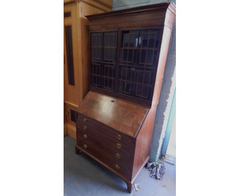 A 19thC and later bureau bookcase, the top with a moulded cornice above two glazed doors with rectangular astragals, the base