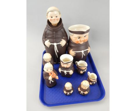 A collection of Goebel ceramic figures of monks, to include a large jug, a decanter and stopper, two pepper pots modelled as 