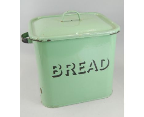 A mid-20thC enamel bread bin, in green, stamped to the front with removable lid and fixed handles, 37cm high.