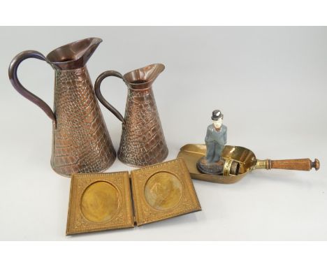 Miscellaneous items of metalware, to include two copper jugs, with stylised scale decoration, a Charlie Chaplin cast iron doo