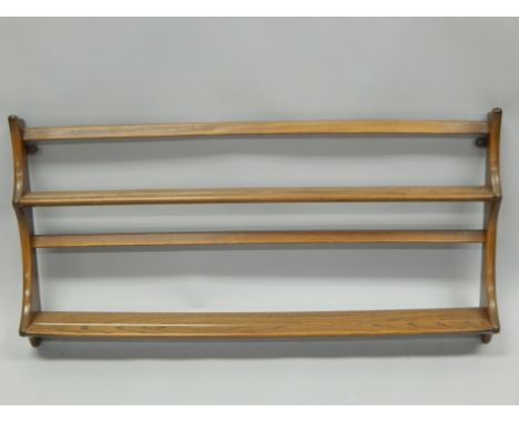 An Ercol type elm plate rack, with two shelves on end supports, 97cm wide. 