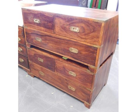A pair of modern hardwood and brass bound military type chests, each with two short and one long drawer on bracket feet, 112c