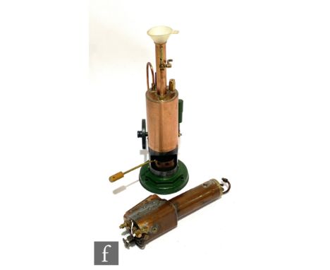 A toy steam engine with vertical brass boiler, spoked fly wheel and steam tap, height 28cm. 