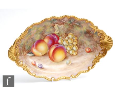 A Royal Worcester Fallen Fruits shaped oval dish decorated by Ayrton with hand painted peaches and white grapes, signed, blac