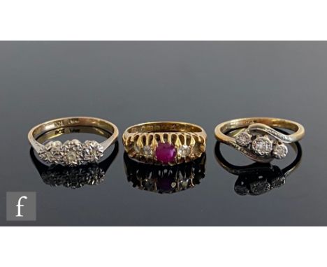 A 18ct ruby and diamond boat shaped ring, two stones missing, weight 4g, with two 9ct illusion set three stone diamond rings,